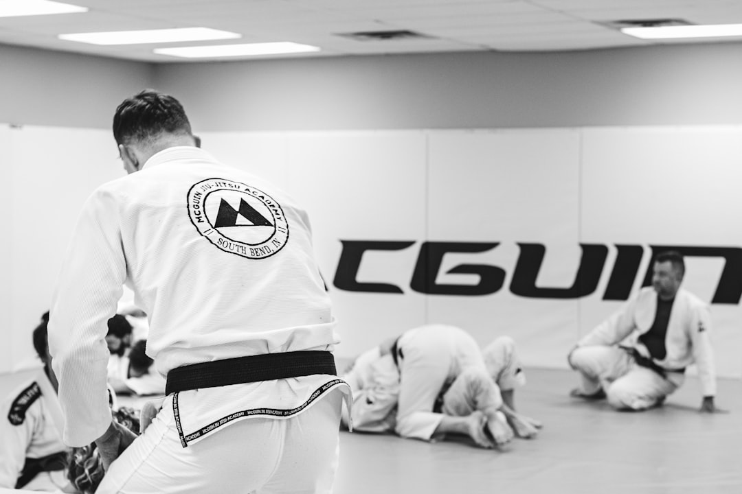 a group of people in a gym doing karate